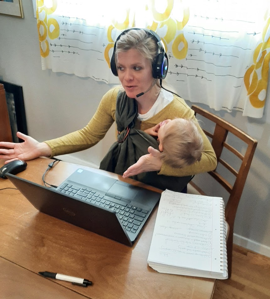 Rebecca Wakelin at computer with baby