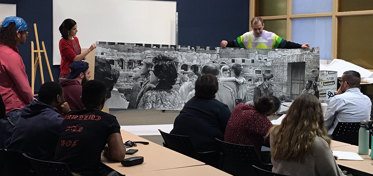 Olexander Wlasenko showing his drawings during an artist talk