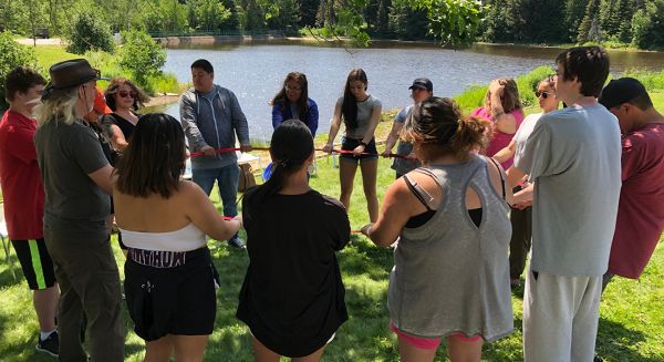Summer Indigenous Institute group by pond