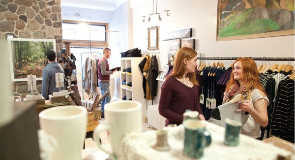 people standing in a shop browsing products
