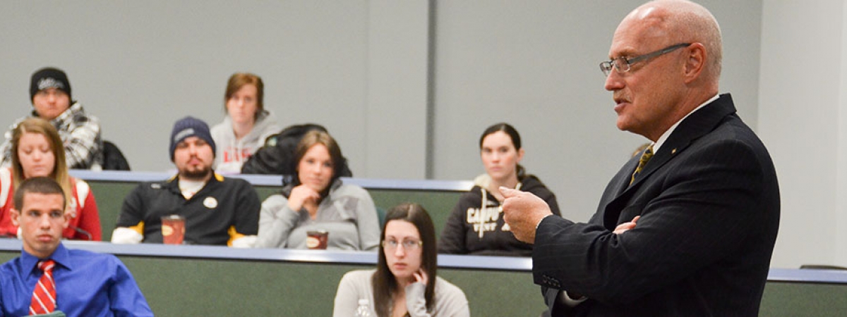 Former O.P.P. Commissioner Chris Lewis talks with Criminal Justice students