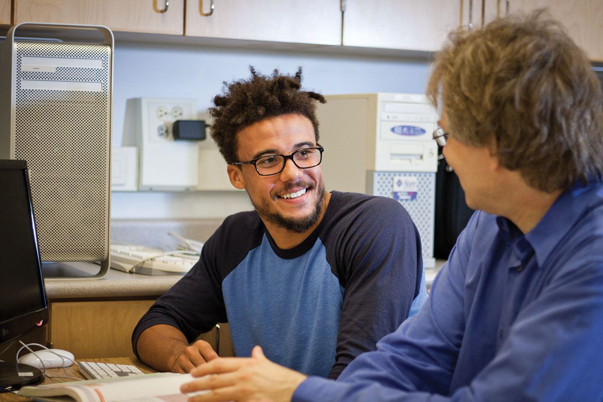 A student talking to a professor