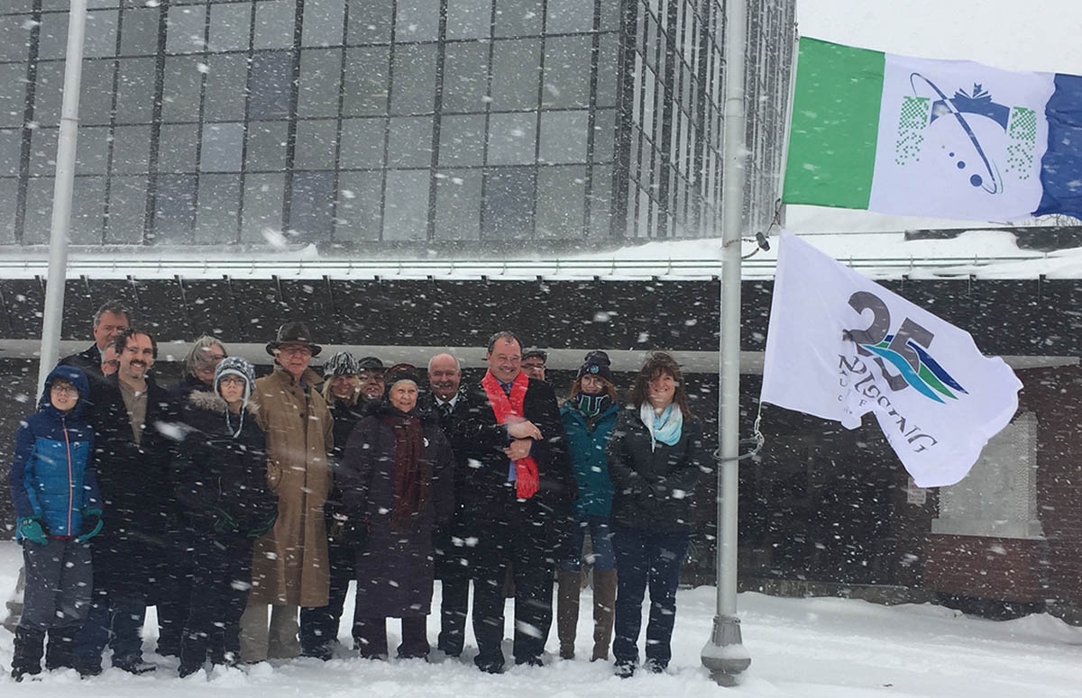 Nipissing’s NU25 flag atop the flagpole at City Hall