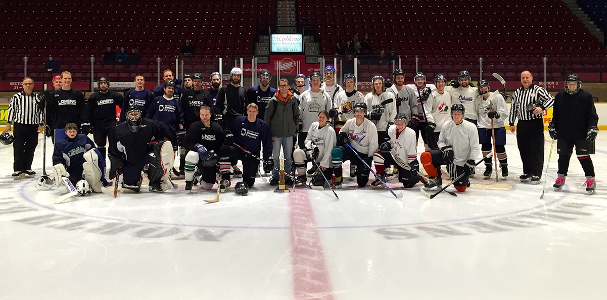 Paul Nelson Memorial Game teams on ice