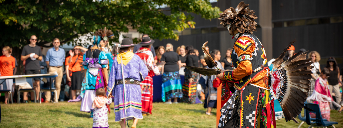 Dancers in regalia at the Nipissing and Canadore Welcome Back Pow Wow 