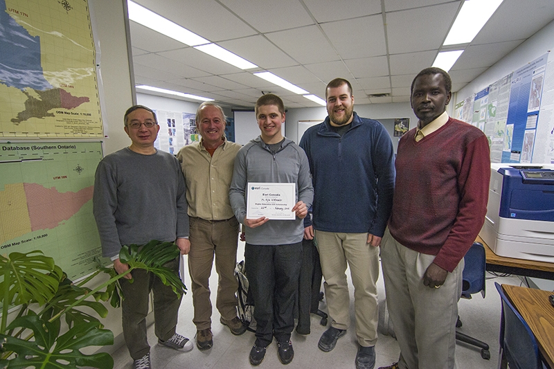 Photo of Kyle Wittmaier receiving ESRI scholarship