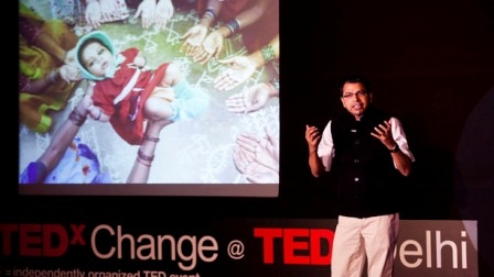 Photo of Ted talk speaker on a stage