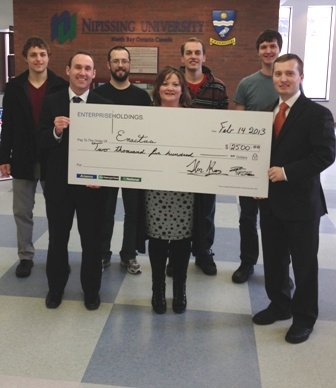 Photo of Enterprise Holdings presenting cheque to Enactus/SIFE Nipissing University