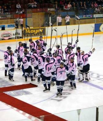 Pink the rink team on ice