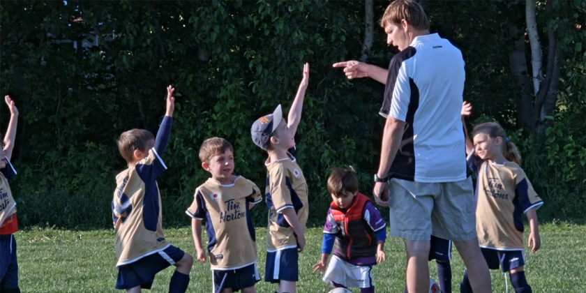 Dr. Mark Bruner coaching youth soccer