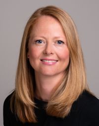 A female worker smiling at the camera