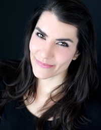 Shawna Partridge from the shoulder up against a black background