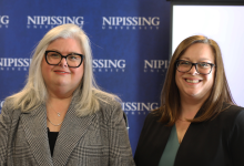 Drs. Wamsley, Sullivan and Law standing in front of a Nipissing background 