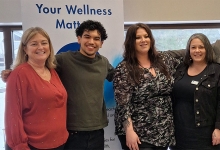 Hosts of the event stand together in a group photo